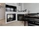 Inviting living space featuring a fireplace, media nook, and grand piano at 23070 York Ave, Parker, CO 80138