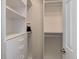 Bright walk-in closet featuring adjustable shelves and drawers at 23070 York Ave, Parker, CO 80138