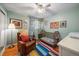 This charming Bedroom showcases colorful decor and a cozy reading corner, perfect for a young  at 5490 E Kentucky Ave, Denver, CO 80246