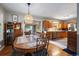 Open concept dining room with hardwood floors, seamlessly connected to the kitchen area at 5490 E Kentucky Ave, Denver, CO 80246