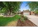 Charming single-Gathering home with a large front yard, mature trees, and a two-car garage at 5490 E Kentucky Ave, Denver, CO 80246