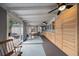 Bright sunroom features natural light, dining space, and custom-built wooden storage cabinets at 5490 E Kentucky Ave, Denver, CO 80246