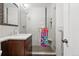 Modern bathroom with glass enclosed shower, sleek vanity, and stylish fixtures at 2925 S Harrison St, Denver, CO 80210