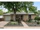 Charming single-story home with mature trees, well-manicured landscaping, and inviting curb appeal at 2925 S Harrison St, Denver, CO 80210