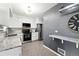 Modern kitchen featuring white cabinets, stainless steel appliances, and granite countertops at 2925 S Harrison St, Denver, CO 80210