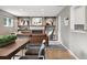 Inviting living room with hardwood floors, brick fireplace, and stylish built-in shelves at 2925 S Harrison St, Denver, CO 80210