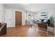Bright living room with hardwood floors, a modern sofa, and large windows providing natural light at 2925 S Harrison St, Denver, CO 80210