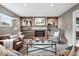 Comfortable living area with a brick fireplace, custom shelving, and neutral decor at 2925 S Harrison St, Denver, CO 80210