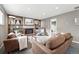 Cozy living room featuring a brick fireplace, built-in shelving, and comfortable seating at 2925 S Harrison St, Denver, CO 80210