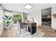 Bright home office with wood floors, neutral decor, and sliding door access to the backyard patio at 2925 S Harrison St, Denver, CO 80210