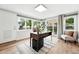 Bright home office with lots of natural light from multiple windows, wood flooring, and neutral decor at 2925 S Harrison St, Denver, CO 80210