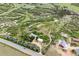 Expansive aerial view of property with multiple structures, lush greenery, and rolling hills at 2938 Wolfensberger Rd, Sedalia, CO 80135