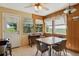 Eat-in dining area with wood paneling, scenic views, and ample natural light at 2938 Wolfensberger Rd, Sedalia, CO 80135