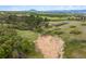 Expansive acreage with rolling hills, lush greenery, and a serene, natural landscape at 2938 Wolfensberger Rd, Sedalia, CO 80135