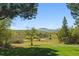 Expansive lot featuring rolling green hills and mountain views at 2938 Wolfensberger Rd, Sedalia, CO 80135
