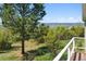 Beautiful outdoor view from the balcony showcasing lush green landscapes and rolling hills at 2938 Wolfensberger Rd, Sedalia, CO 80135