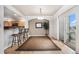 Open dining area with hardwood floors and sliding glass door to exterior at 6617 S Forest Way # E, Centennial, CO 80121