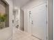 Inviting entryway with tiled floors and view into the home at 6617 S Forest Way # E, Centennial, CO 80121