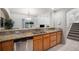 Spacious kitchen with countertop bar overlooking the dining area and backyard at 6617 S Forest Way # E, Centennial, CO 80121