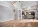 Spacious living area showcasing hardwood floors and open floor plan to kitchen at 6617 S Forest Way # E, Centennial, CO 80121