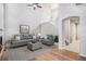 Living room with gray furniture, fireplace, and hardwood floors, creating a cozy atmosphere at 6617 S Forest Way # E, Centennial, CO 80121