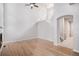Open living room with hardwood floors, tall ceilings, and natural light at 6617 S Forest Way # E, Centennial, CO 80121