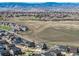 Elevated view of a neighborhood shows rolling hills and mountain views at 3534 N Meadows Dr, Castle Rock, CO 80109
