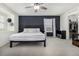 Comfortable bedroom with ceiling fan, window nook, and sleek black headboard at 3534 N Meadows Dr, Castle Rock, CO 80109