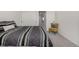 Well-lit bedroom showcasing a comfortable bed, charming yellow chair, and ample natural light at 3534 N Meadows Dr, Castle Rock, CO 80109