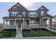 Two-story house with a inviting porch, showcasing a home's design and exterior appeal at 3534 N Meadows Dr, Castle Rock, CO 80109