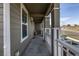 Covered porch featuring classic pillars, railings, creating a welcoming transition to the front door at 3534 N Meadows Dr, Castle Rock, CO 80109