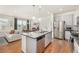 Contemporary kitchen featuring a granite island, stainless steel appliances, and an open layout at 3534 N Meadows Dr, Castle Rock, CO 80109