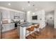 Modern kitchen with granite countertops, stainless steel appliances, and a stylish island with seating at 3534 N Meadows Dr, Castle Rock, CO 80109