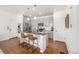 Modern kitchen with stainless steel appliances, granite countertops, and a stylish island with seating at 3534 N Meadows Dr, Castle Rock, CO 80109