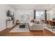Bright and airy living room featuring modern furnishings, a large window, and stylish decor at 3534 N Meadows Dr, Castle Rock, CO 80109