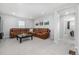 Bright living room showcases a large sectional sofa, modern decor, and gray carpeting at 3534 N Meadows Dr, Castle Rock, CO 80109