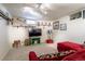 Cozy basement features plush carpet, soft lighting, decorative shelving, and a comfortable seating area at 4530 S Inca St, Englewood, CO 80110