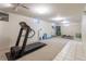 Finished basement featuring carpeted flooring, workout area, and room for storage at 4530 S Inca St, Englewood, CO 80110