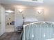 Bedroom with neutral walls, tiled floor, and walk-in access to a large carpeted room at 4530 S Inca St, Englewood, CO 80110