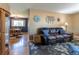 Inviting living room open to dining, featuring hardwood floors and neutral tones at 4530 S Inca St, Englewood, CO 80110