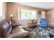 Cozy living room with hardwood floors, a large window, and neutral paint tones at 4530 S Inca St, Englewood, CO 80110