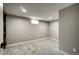 Inviting basement space featuring comfortable carpeting and a window for natural illumination at 363 Lima St, Aurora, CO 80010