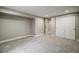 Finished basement showcases neutral decor, soft carpet, and a convenient closet for ample storage at 363 Lima St, Aurora, CO 80010