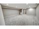Finished basement with neutral carpet, recessed lighting, and a built-in bar area at 363 Lima St, Aurora, CO 80010