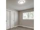 Bedroom featuring wood-look floors, closet doors, and a window with blinds at 363 Lima St, Aurora, CO 80010