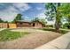 Charming ranch-style home boasts a brick facade, inviting entrance, and a partially landscaped yard at 363 Lima St, Aurora, CO 80010