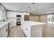 Spacious kitchen with a large island, modern appliances, pendant lights, and ample cabinet space at 363 Lima St, Aurora, CO 80010
