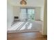 Living room with sliding glass doors to outside deck, with plush carpeting at 695 S Alton Way # 6B, Denver, CO 80247
