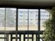 Interior sun room view of the building and exterior landscape at 695 S Alton Way # 6B, Denver, CO 80247
