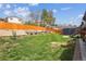 Expansive backyard offering a lush lawn, privacy fence, and ample space for outdoor activities at 9379 W Burgundy Ave, Littleton, CO 80123